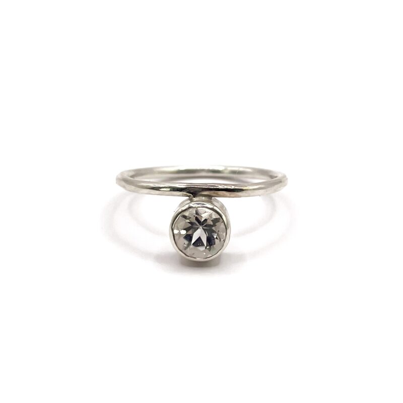 Silver ring with white topaz