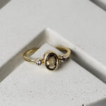 Ring with a brown sapphire and small diamonds on either side